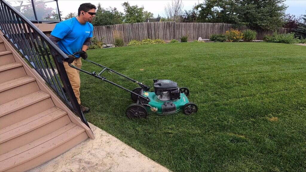 A man mowing a lawn