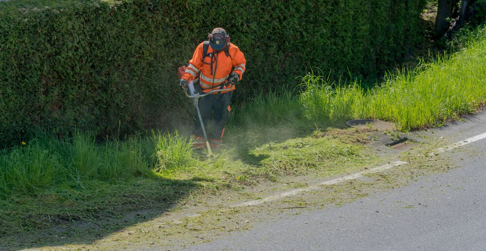 Man aerating a lawn